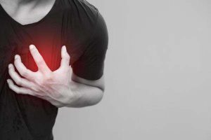 man-having-chest-pain-heart-attack-outdoors-or-heavy-exercise-causes-the-body-to-shocks-heart-disease-photo